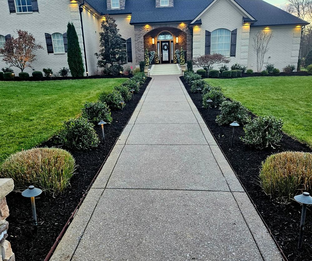 Front yard walkway with landscape lighting at dusk