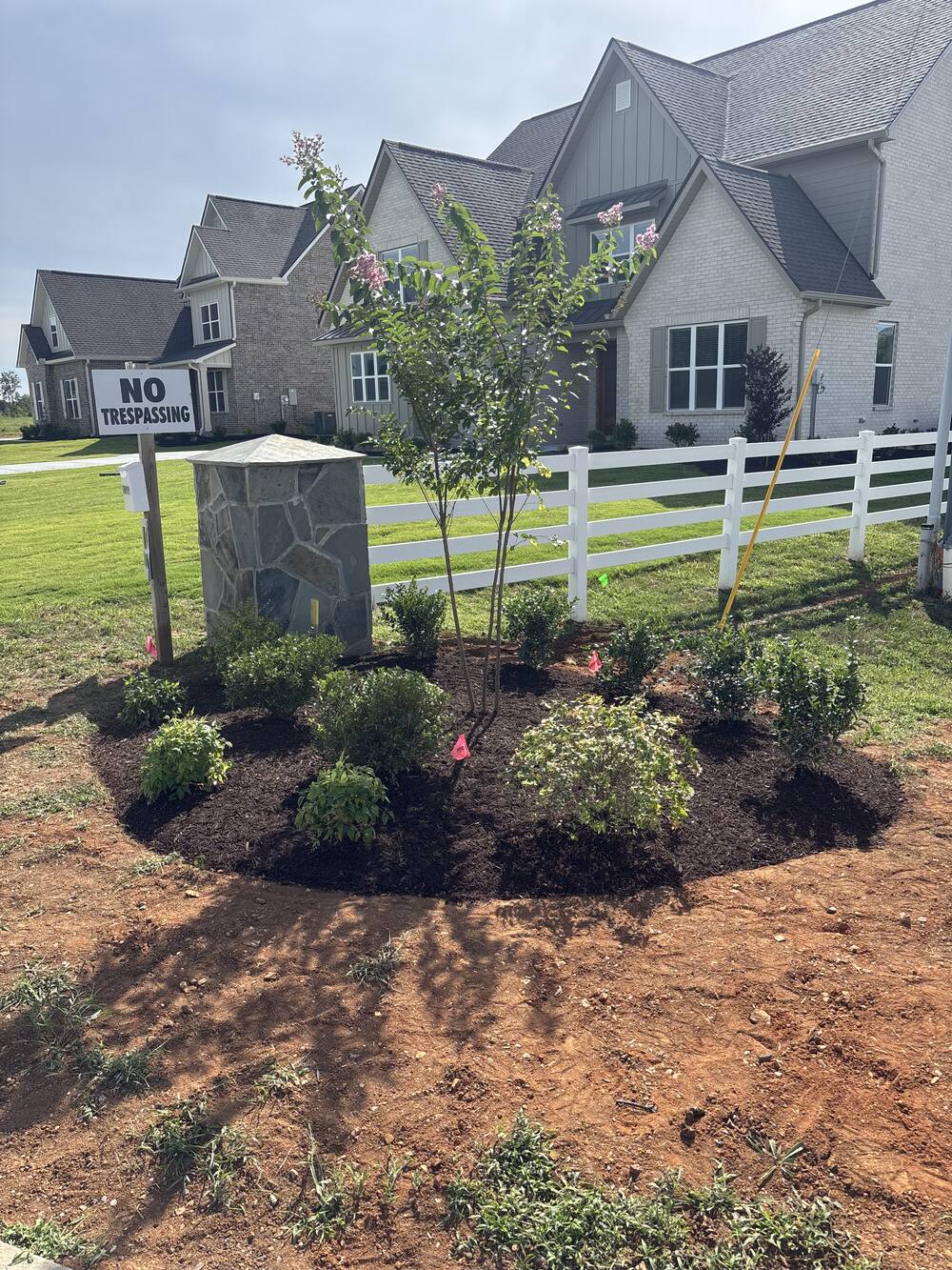 Stone mailbox column planting bed with crape myrtle