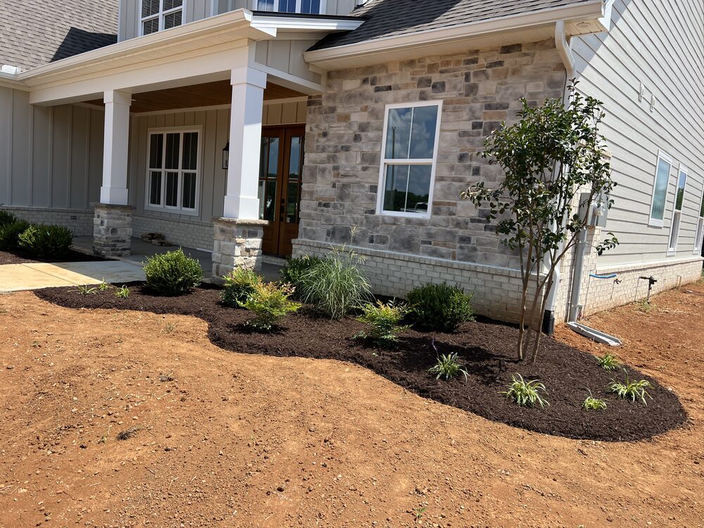 Foundation planting bed at craftsman-style front entry